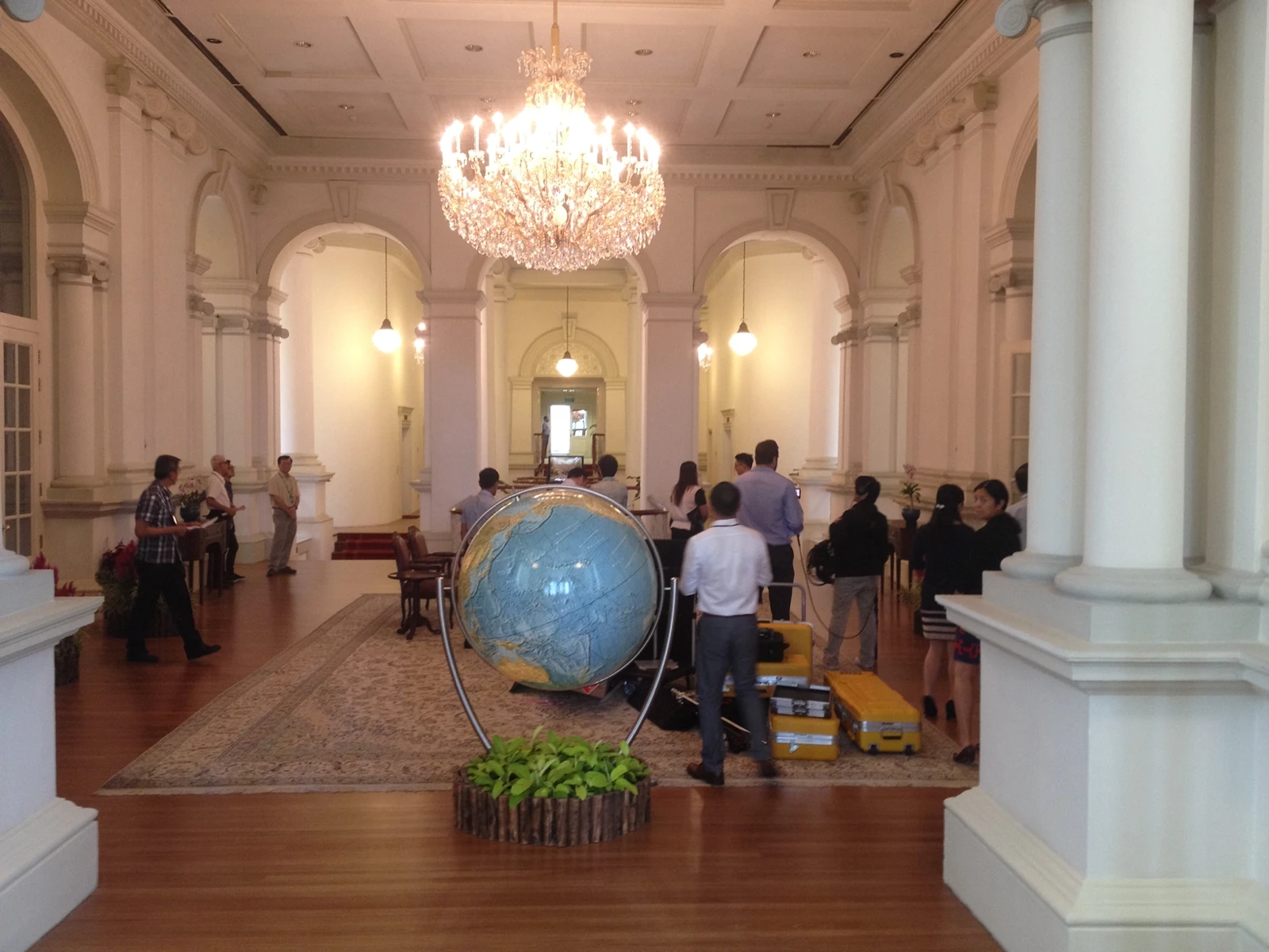 Ozmov team preparing equipment inside a major Singapore venue